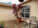 Small courtyard with potted plants and gravel at 14101 Vista Del Lago Blvd, Clermont, FL 34711