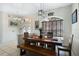 Inviting dining room featuring a dining table, a window and tile flooring at 14101 Vista Del Lago Blvd, Clermont, FL 34711