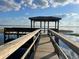 Picturesque dock leading to a covered gazebo on the water at 14101 Vista Del Lago Blvd, Clermont, FL 34711