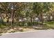 Gated entrance to a waterfront property with a pier, offering privacy and exclusive access to a scenic dock at 14101 Vista Del Lago Blvd, Clermont, FL 34711