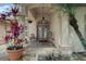 Inviting front porch with decorative plants, columns, and double doors creating a welcoming entrance at 14101 Vista Del Lago Blvd, Clermont, FL 34711