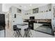 Well-lit kitchen features an island, granite countertops, and ample cabinet space at 14101 Vista Del Lago Blvd, Clermont, FL 34711