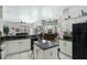 Bright, open kitchen flows into a dining area with abundant natural light at 14101 Vista Del Lago Blvd, Clermont, FL 34711