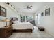 Bright main bedroom features tile flooring, natural light, and a ceiling fan at 14101 Vista Del Lago Blvd, Clermont, FL 34711