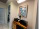 Home office or landing area featuring a desk and doorway access to other rooms at 14101 Vista Del Lago Blvd, Clermont, FL 34711