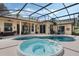 Backyard pool and spa featuring a screened enclosure, lounge seating, and covered patio area at 14101 Vista Del Lago Blvd, Clermont, FL 34711