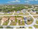 Aerial view of single-Gathering home with driveway and yard at 1461 Teal Dr, Kissimmee, FL 34759