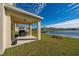 Covered patio overlooking a tranquil lake at 1490 Woodmont Blvd, Kissimmee, FL 34746