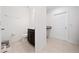 Small bathroom with toilet and dark vanity at 1490 Woodmont Blvd, Kissimmee, FL 34746