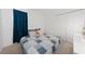 Bedroom with a double bed, dresser, and teal curtains at 1490 Woodmont Blvd, Kissimmee, FL 34746