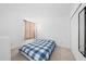 Bedroom with a double bed, beige curtains, and dresser at 1490 Woodmont Blvd, Kissimmee, FL 34746