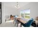 Dining room with a wooden table and chairs, overlooking a pond at 1490 Woodmont Blvd, Kissimmee, FL 34746