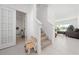 Bright and spacious entryway with stairs leading to the second floor at 1490 Woodmont Blvd, Kissimmee, FL 34746