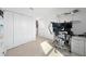 Home office with multiple monitors, desk, and built-in shelves at 1490 Woodmont Blvd, Kissimmee, FL 34746