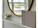 Entryway with a shelf, mirror, and books at 1542 Wax Myrtle Way, Haines City, FL 33844