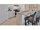 Modern kitchen with island, stainless steel appliances at 1542 Wax Myrtle Way, Haines City, FL 33844