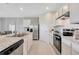 Modern kitchen with stainless steel appliances and granite counters at 1542 Wax Myrtle Way, Haines City, FL 33844
