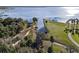 Gorgeous aerial view overlooking the lake and lush landscape. Serene waterfront property at 1595 Stone Trl, Deltona, FL 32725