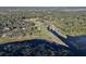 Stunning aerial view of waterfront property featuring a canal and lush vegetation. A serene and picturesque setting at 1595 Stone Trl, Deltona, FL 32725