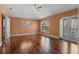 Large bedroom has lots of natural light, hard surface floors, and a private door to the outside at 1595 Stone Trl, Deltona, FL 32725