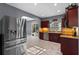 This kitchen features stainless steel appliances, recessed lighting, and views to the outside pool at 1595 Stone Trl, Deltona, FL 32725