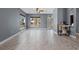 Spacious living room featuring neutral walls, marble floors, and a beautiful view of the front yard at 1595 Stone Trl, Deltona, FL 32725