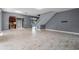 Open-concept floor plan with marble floors that connects the living and kitchen areas at 1595 Stone Trl, Deltona, FL 32725
