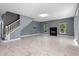 Bright and airy living room with marble floors and a cozy fireplace at 1595 Stone Trl, Deltona, FL 32725