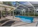 Inviting screened-in pool with lounge area and covered patio with ceiling fans for relaxing outdoor living at 1595 Stone Trl, Deltona, FL 32725
