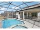 Inviting pool and spa with screened enclosure, perfect for relaxation at 2052 Fleming Mist Pl, Kissimmee, FL 34747