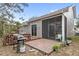 Brick patio, deck, and grill in backyard at 2705 Grantham Ct, Orlando, FL 32835
