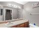 Simple bathroom with a single vanity, toilet, and mirror at 2705 Grantham Ct, Orlando, FL 32835