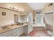 Elegant bathroom featuring a soaking tub, double vanity, and shower at 2705 Grantham Ct, Orlando, FL 32835