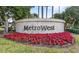 MetroWest community entrance sign with red poinsettia flowers at 2705 Grantham Ct, Orlando, FL 32835