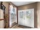 Bright entryway with double doors and a window, showcasing natural light at 2705 Grantham Ct, Orlando, FL 32835