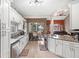 Modern kitchen with white cabinets, granite counters and breakfast bar at 2705 Grantham Ct, Orlando, FL 32835