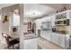 Modern kitchen with white cabinets, granite counters and breakfast bar at 2705 Grantham Ct, Orlando, FL 32835