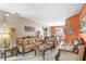 Spacious living room featuring plush seating and a view to the dining area at 2705 Grantham Ct, Orlando, FL 32835