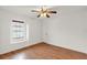 Well-lit bedroom with wood flooring and a ceiling fan at 2841 Derby Dr, Deltona, FL 32738