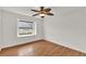 Bright bedroom with hardwood floors and ceiling fan at 2841 Derby Dr, Deltona, FL 32738
