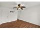 Spacious bedroom with hardwood floors and ceiling fan at 2841 Derby Dr, Deltona, FL 32738