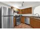 Kitchen with stainless steel appliances and wood cabinets at 2841 Derby Dr, Deltona, FL 32738
