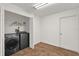 Laundry room with washer, dryer, and built-in shelving at 2841 Derby Dr, Deltona, FL 32738