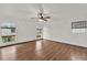 Large main bedroom with wood floors and ceiling fan at 2841 Derby Dr, Deltona, FL 32738