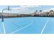 Full-size outdoor basketball court with blue painted surface at 297 Jetty Way, Davenport, FL 33897