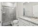 Modern bathroom with a granite vanity and a shower at 297 Jetty Way, Davenport, FL 33897