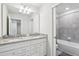 Clean bathroom with double sinks and a shower/tub combo at 297 Jetty Way, Davenport, FL 33897