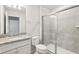 Clean bathroom, featuring a granite vanity and a glass shower at 297 Jetty Way, Davenport, FL 33897