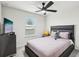 Bright bedroom with a comfortable bed and plenty of natural light at 297 Jetty Way, Davenport, FL 33897