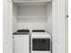 Convenient laundry room with a washer and dryer at 297 Jetty Way, Davenport, FL 33897